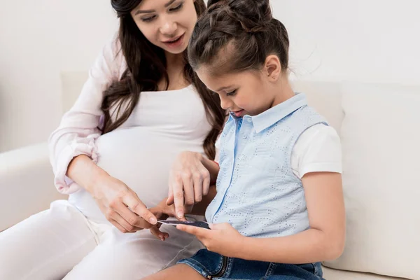 girl looking at pregnancy ultrasound photo