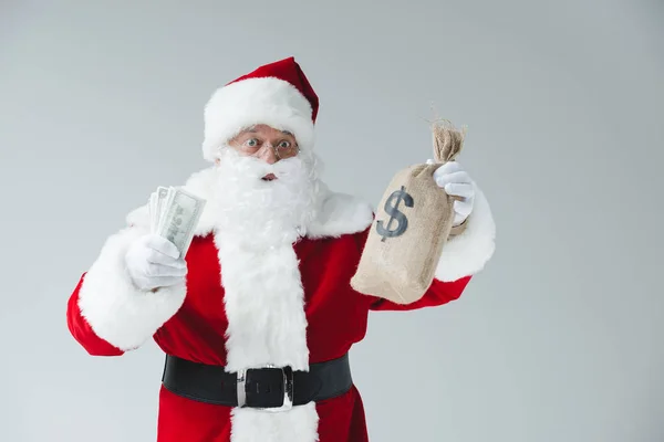 Kerstman met dollar biljetten — Stockfoto