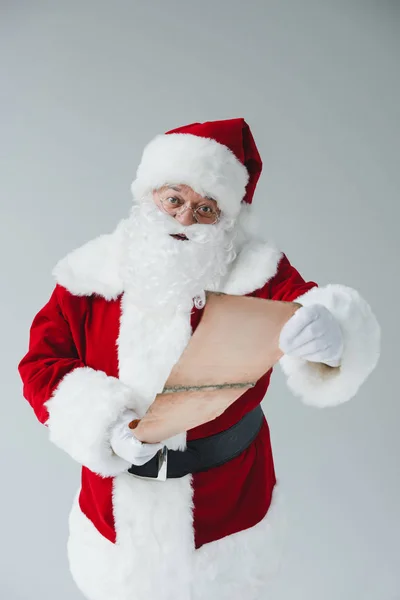 Santa claus with wish list — Stock Photo, Image