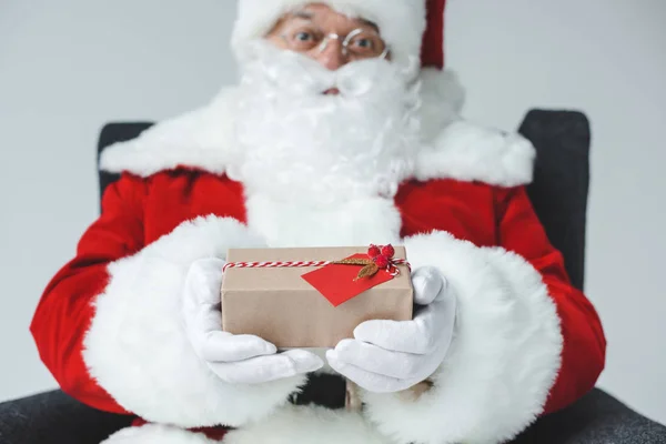 Santa claus with wrapped gift — Stock Photo, Image