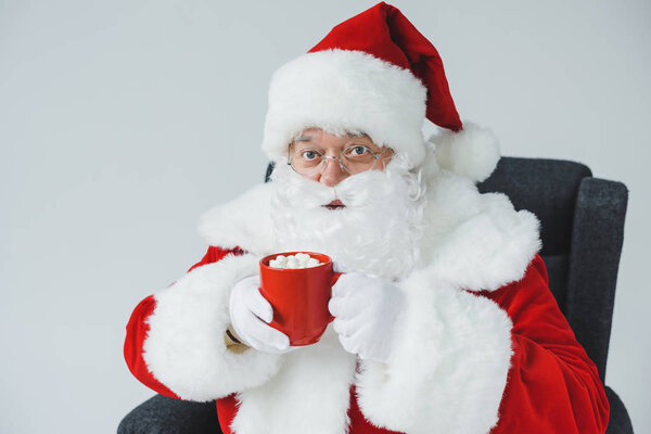 santa drinking hot chocolate with marshmallows