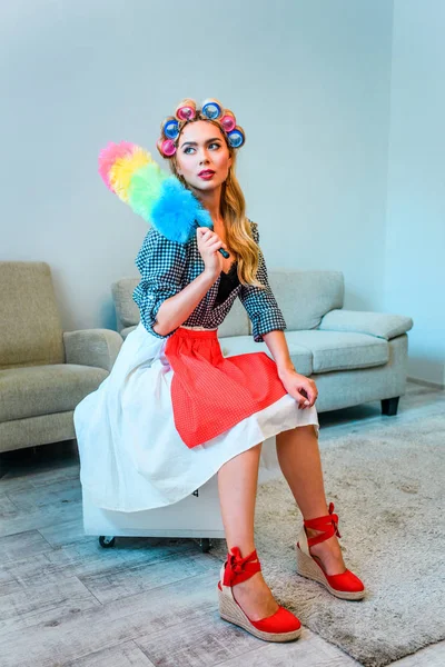 Housewife posing with duster — Stock Photo, Image