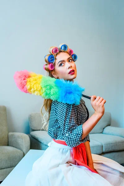 Housewife posing with duster — Stock Photo, Image