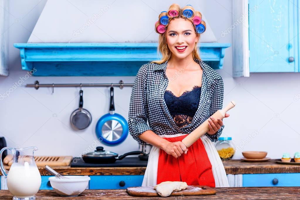 housewife with dough and rolling pin
