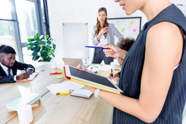 Businesswoman with tablet at conference — Stock Photo, Image