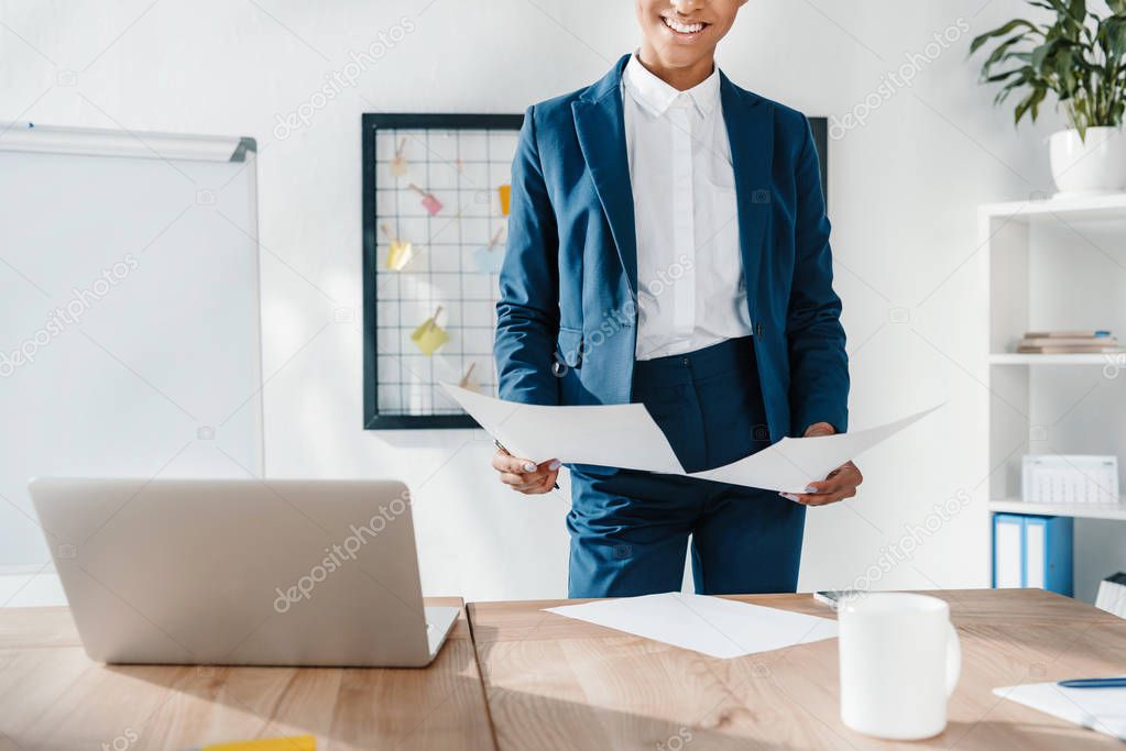 businesswoman holding papers