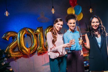 multiethnic women celebrating new year clipart