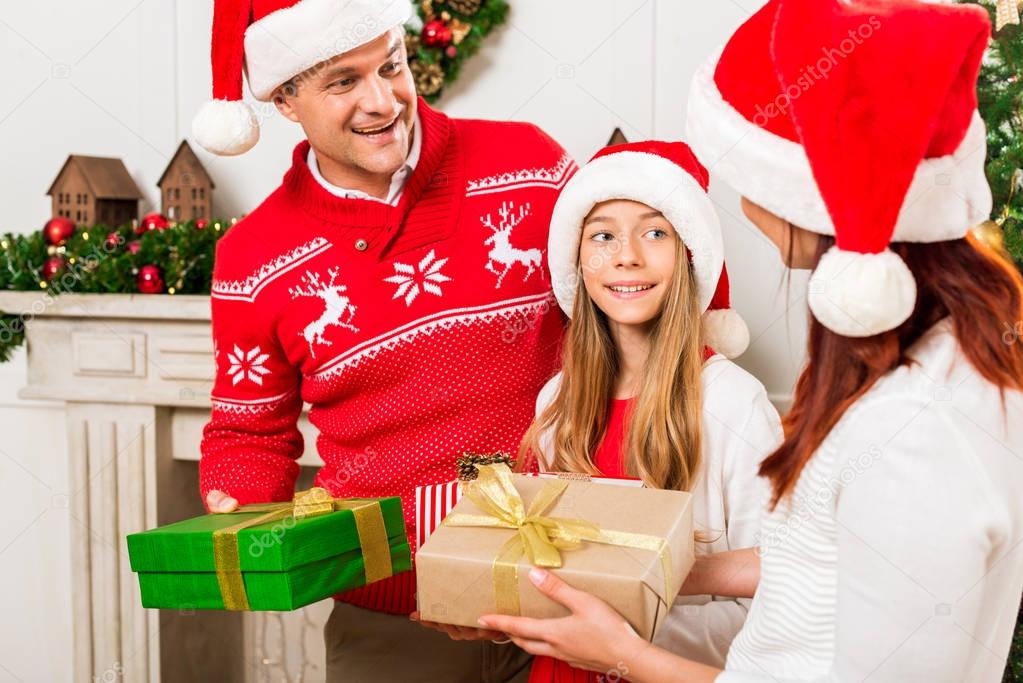 Parents giving presents to daughter — Stock Photo © AllaSerebrina