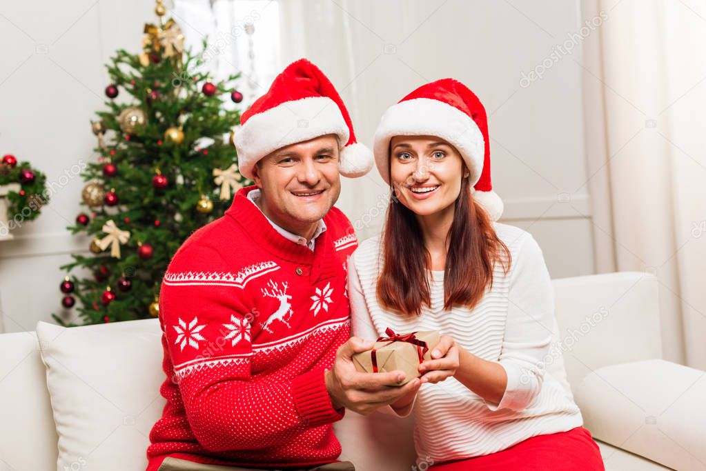 mature couple with christmas gift