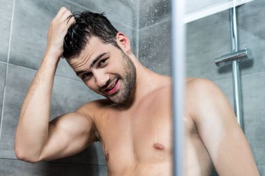 young man taking shower clipart