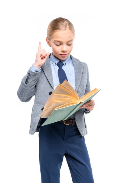 Schoolgirl in reading book — Free Stock Photo