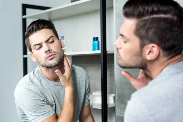 Man checking his bristle — Stock Photo, Image