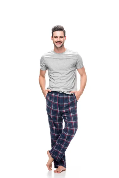 Ung man i pyjamas — Stockfoto