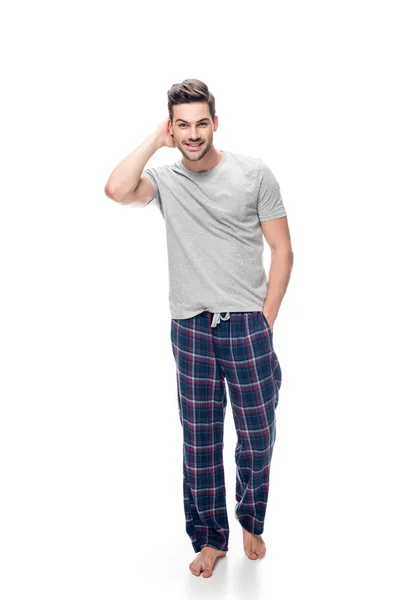 Jonge man in pyjama 's — Stockfoto
