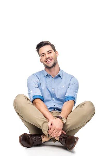 Young man sitting on floor — Stock Photo, Image