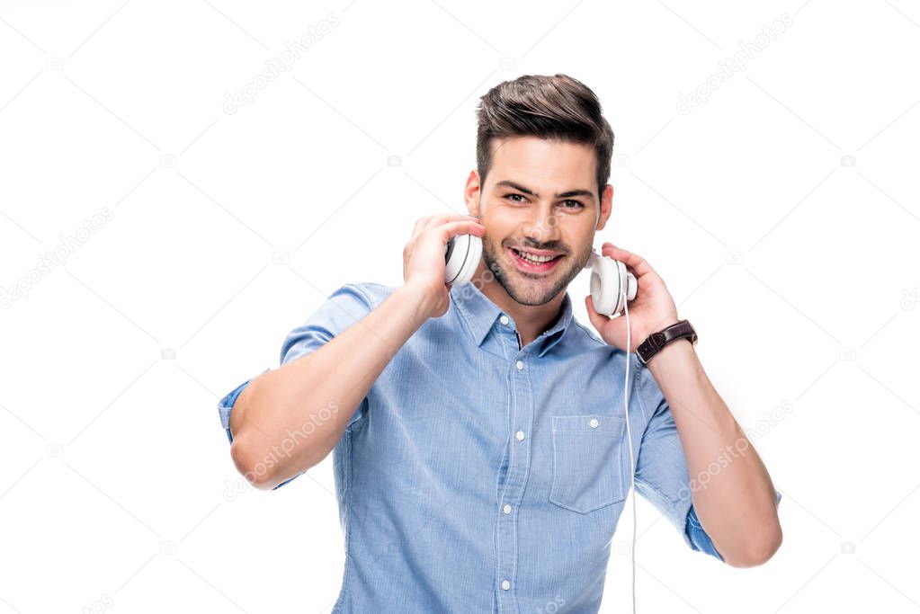 man taking off headphones