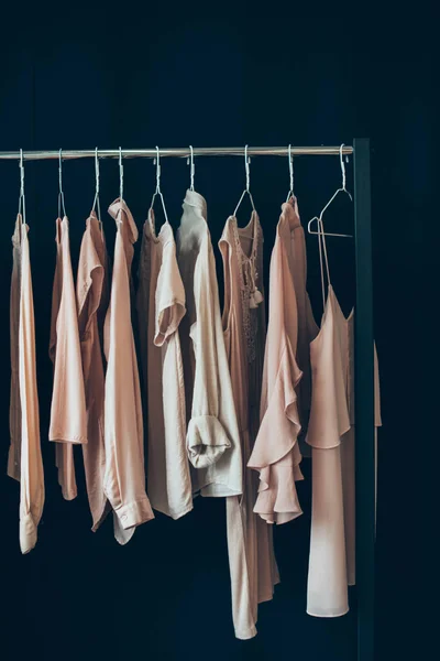 Clothing hanging on clothes rack — Stock Photo, Image