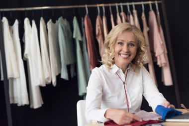 businesswoman choosing fabric samplers clipart