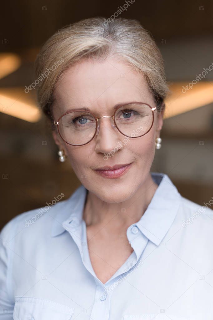 pensive woman in eyeglasses