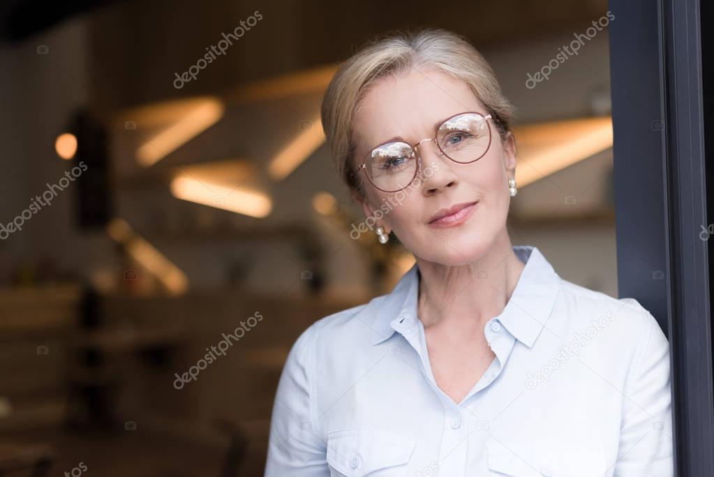 pensive woman in eyeglasses