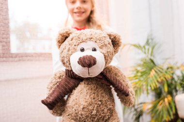 child with teddy bear clipart