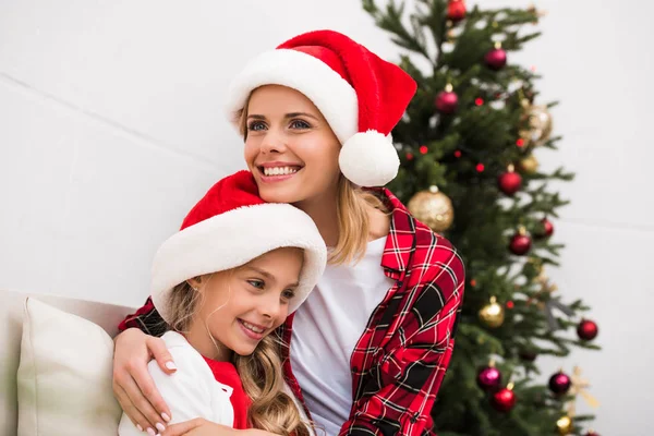 Happy mother and daughter at christmas — Stock Photo, Image