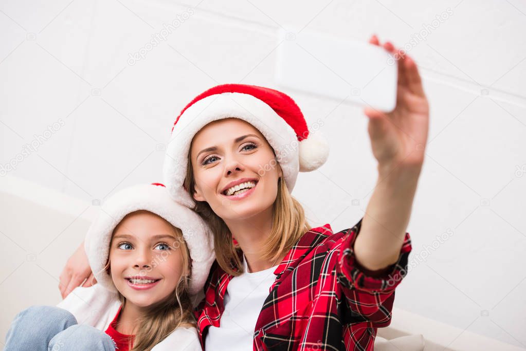 mother and daughter taking selfie