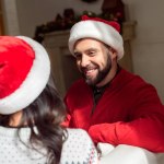 Happy couple in santa hats