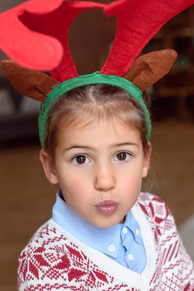 Child in antlers — Stock Photo, Image