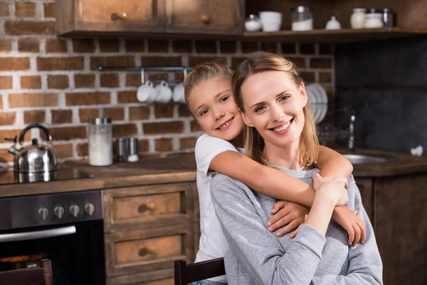 Daughter hugging mother — Stock Photo, Image