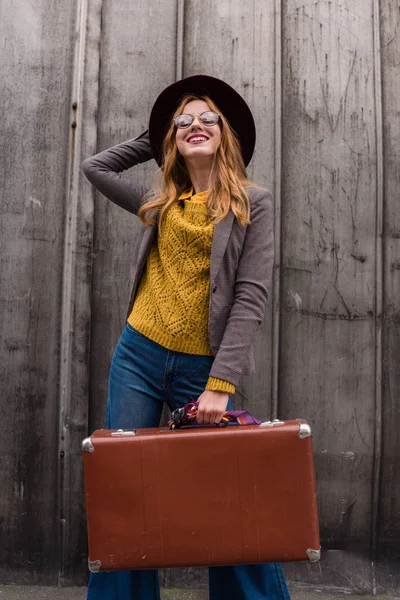 Redhead girl with vintage suitcase — Stock Photo, Image