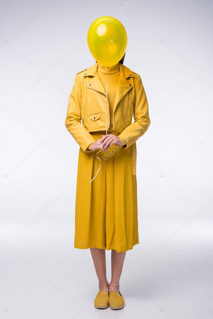 stylish girl in yellow clothes