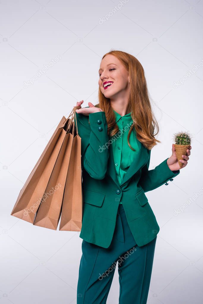 redhead girl with shopping bags