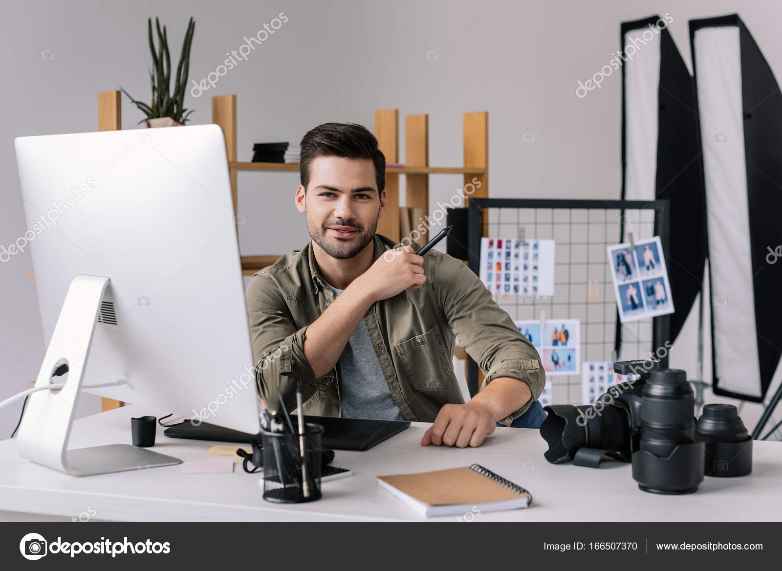 Photographer with graphics tablet — Stock Photo © AllaSerebrina 166507370