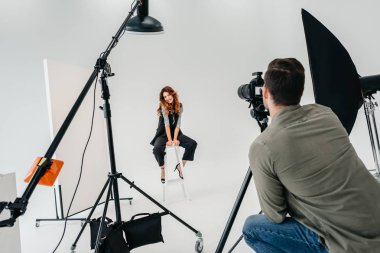 fashion shoot in photo studio clipart