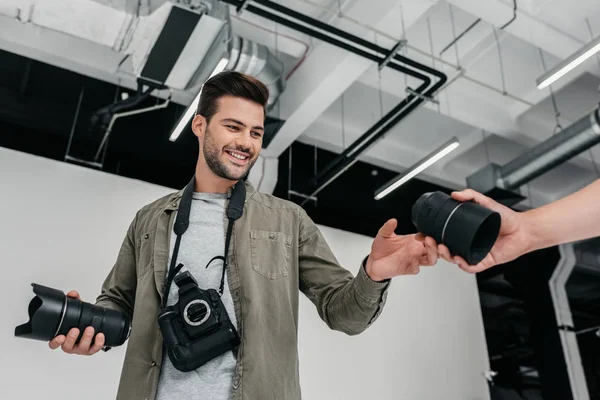 Photographer with camera and lenses — Stock Photo, Image