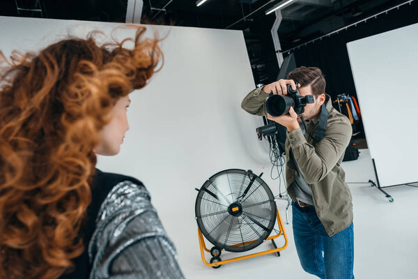 professional photographer and beautiful model 