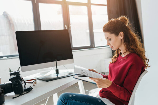 designer reading magazine