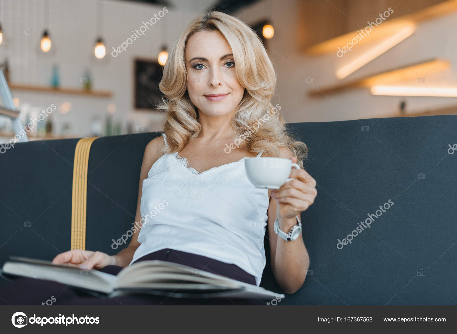 depositphotos_167367568-stock-photo-woman-reading-book-in-cafe.jpg