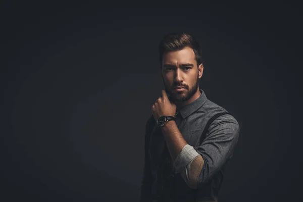 Handsome man with hand on chin — Stock Photo, Image