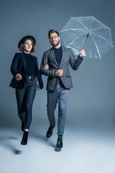 Man and woman walking arm in arm