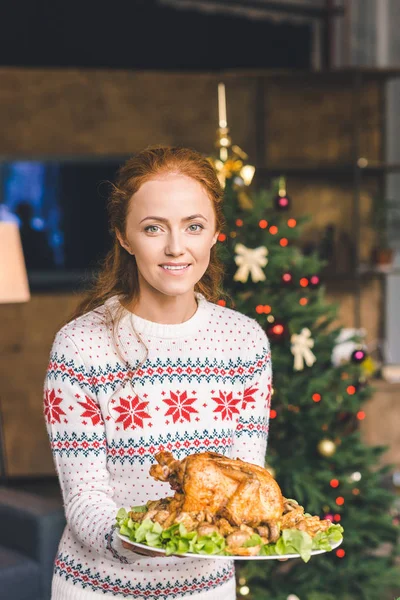 Woman with fried chicken for christmas — Free Stock Photo