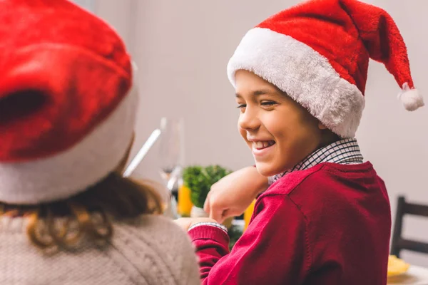Brother and sister in santa hats — Stock Photo, Image
