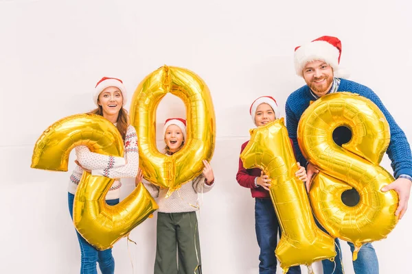 Family holding new year balloons — Stock Photo, Image