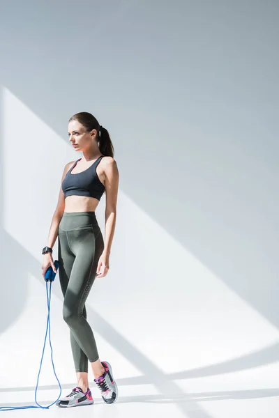 Athletic girl with skipping rope — Stock Photo, Image