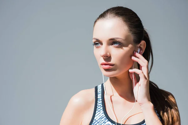 Attractive girl in earphones — Stock Photo, Image