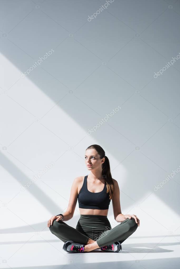 sportswoman sitting with crossed legs