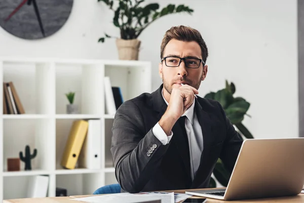 Thoughtful businessman at workplace — Stock Photo, Image