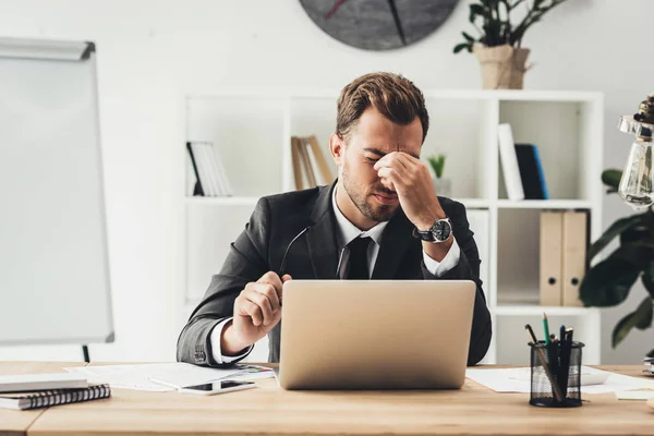 Tired businessman at workplace — Stock Photo, Image