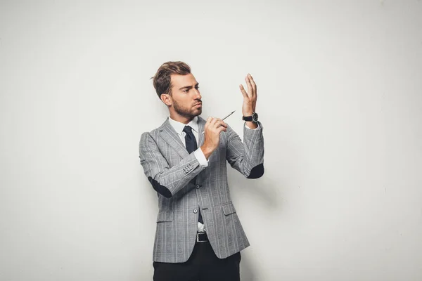 Businessman drawing himself with pencil — Stock Photo, Image